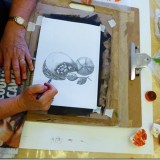 Photocopies of the vegetable drawings being used to create mono-prints